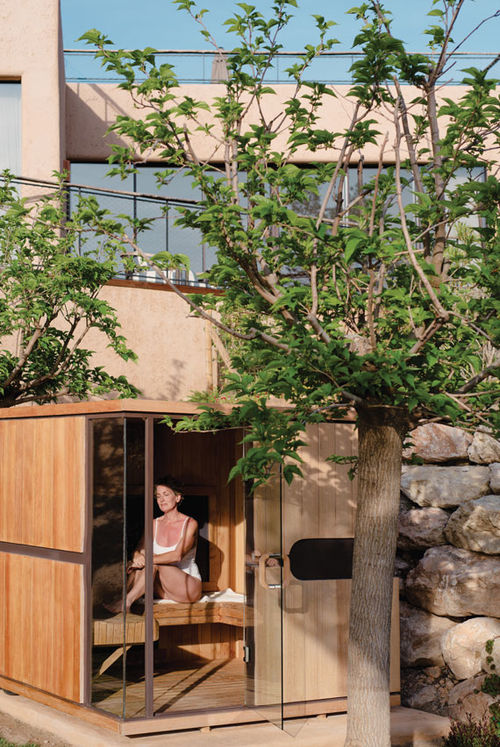 A guest in an infrared sauna at the Six Senses Ibiza's RoseBar.