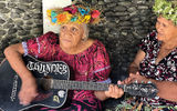 A musician on Ua Huka played near the entrance of a local crafts market.