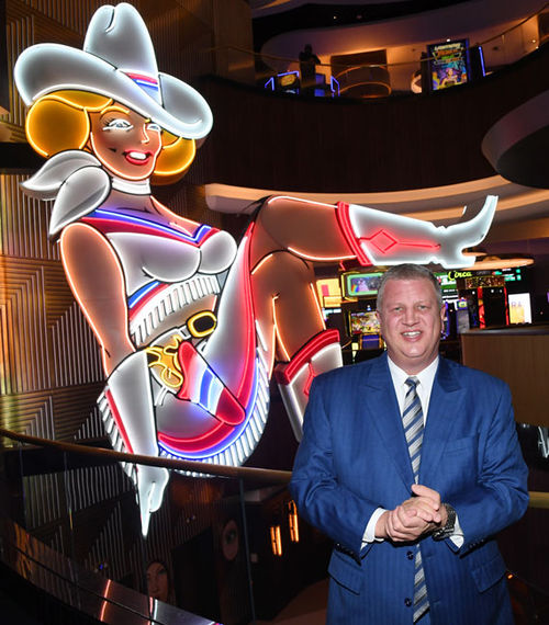 Circa Resort & Casino's CEO Derek Stevens with "Vegas Vickie," the iconic neon cowgirl that now resides in the resort's lobby