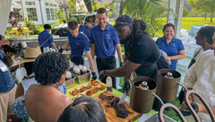 Chef and restaurateur Brian Jupiter serves smoked ribs during The Family Reunion's welcome reception.