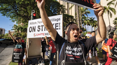 Members of Unite HERE Local 5 gather as part of a Labor Day weekend strike at the Hilton Hawaiian Village Waikiki Beach Resort in Honolulu.