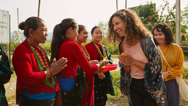 Intrepid Travel guests meet local women in Nepal during the Annapurna Base Camp Trek.