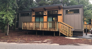 The modern cabins at Fort Wilderness Resort and Campground have clerestory windows to provide natural light. The shed-style cabins come in a handful of colors.