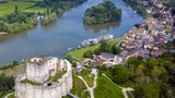 A Tauck riverboat docked near Chateau Gaillard on the Seine River.