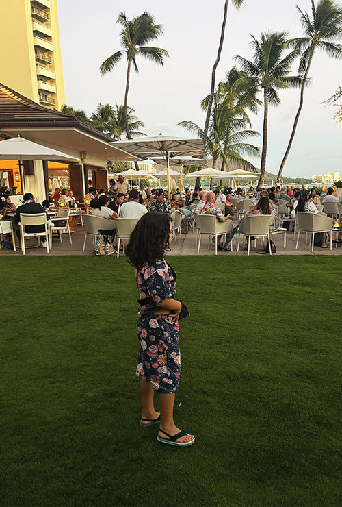 The author's daughter on the lawn outside House Without a Key, with Diamond Head in the background.