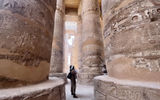 The author gazes in awe at the columns still standing at the ancient Temple of Karnak, part of the monumental city of Thebes and a UNESCO World Heritage Site.