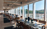 The indoor/outdoor Aquavit Terrace on Deck 5 aboard the Viking Mississippi, one of Viking’s signature features on all of its ships.