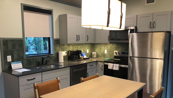 The kitchen in the new cabins is upgraded with a window, a full stove with an oven and a coffeemaker.