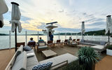 The outdoor terrace lounge and pool area on the sun deck of the Viking Mississippi.