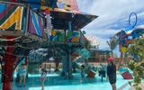 The Rush Out Gush Out water play area features structures inspired by communal Junkanoo shacks.